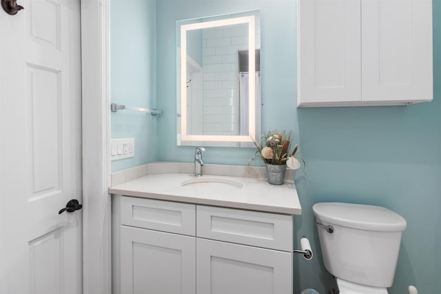 bathroom with toilet and vanity