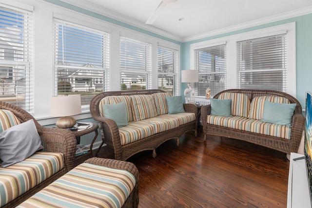 living room with crown molding and wood finished floors