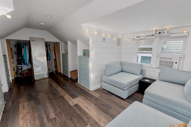 interior space with cooling unit, wood finished floors, and lofted ceiling