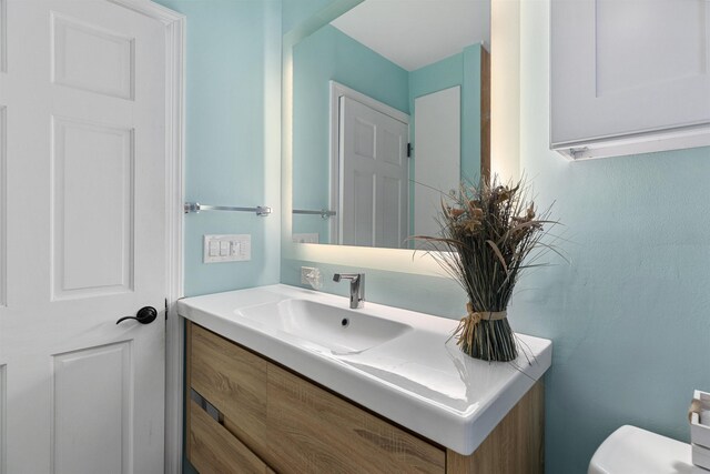 half bath with toilet and vanity