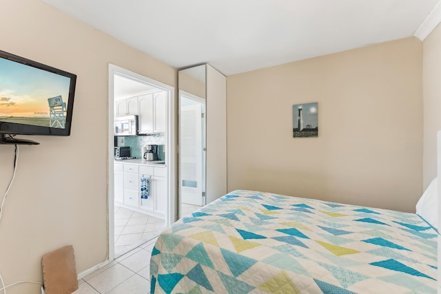300 Ocean Ave Unit 201, North Wildwood, NJ 08260 - bedroom with light tile patterned flooring and ensuite bath