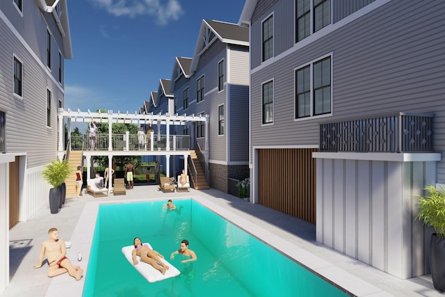 outdoor pool with stairway and a patio