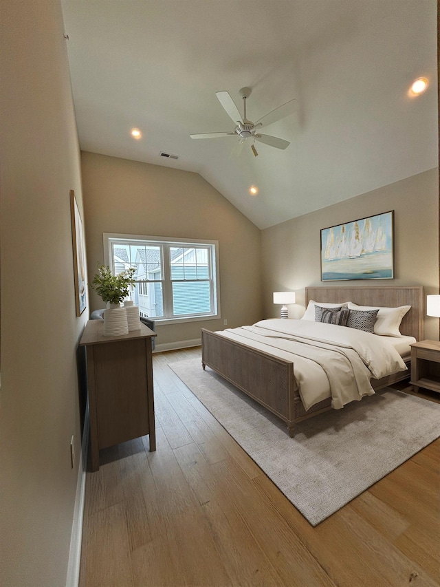 bedroom featuring visible vents, recessed lighting, vaulted ceiling, wood finished floors, and a ceiling fan
