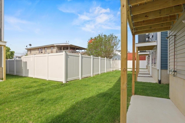 view of yard with a patio area and a fenced backyard