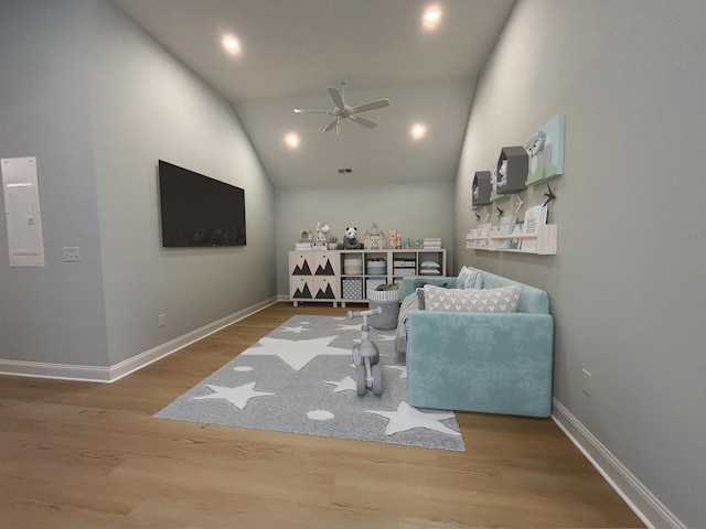 living area featuring recessed lighting, wood finished floors, vaulted ceiling, baseboards, and a ceiling fan