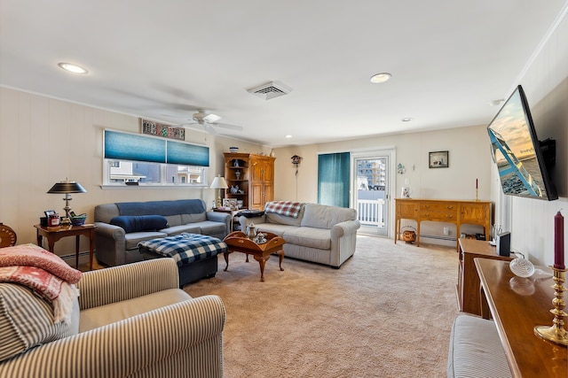 living room featuring light carpet and ceiling fan