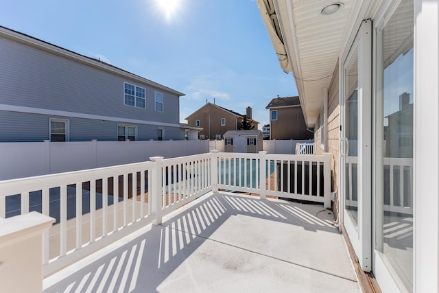 view of patio featuring a storage unit