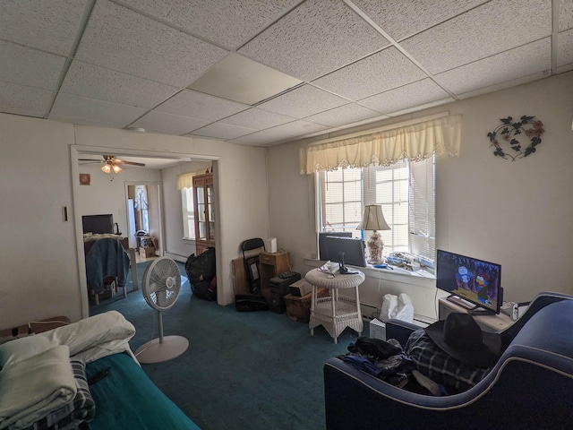 carpeted living room featuring a paneled ceiling and ceiling fan