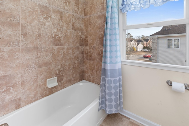 full bath featuring shower / tub combo with curtain