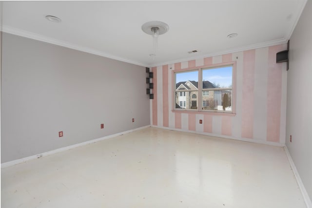 unfurnished room featuring ornamental molding, visible vents, and baseboards