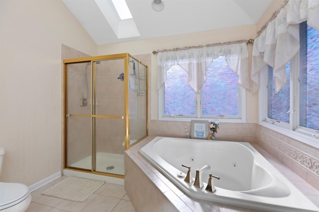 full bathroom with toilet, lofted ceiling with skylight, a jetted tub, and a stall shower