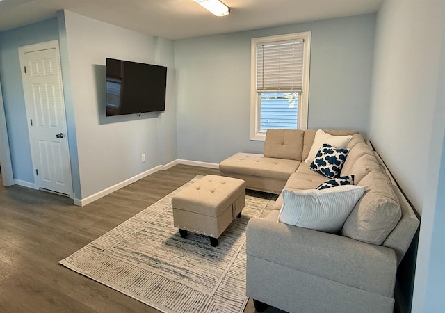 living room with wood finished floors and baseboards