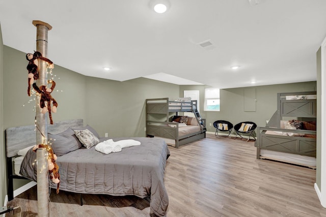 bedroom with hardwood / wood-style floors