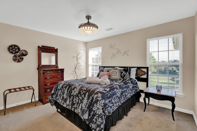 bedroom with light carpet