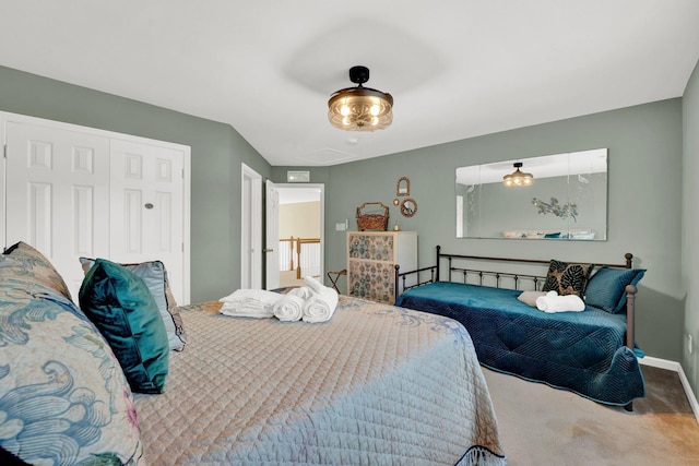 carpeted bedroom with a closet