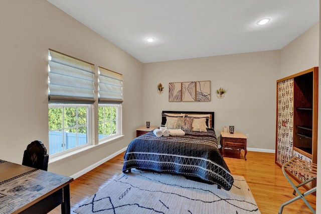 bedroom with wood-type flooring