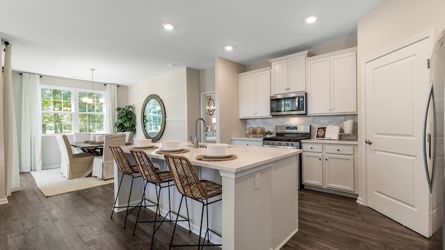 942 Carol Ave, Lower Township, NJ 08204 - kitchen featuring stainless steel appliances, a kitchen island with sink, dark wood finished floors, light countertops, and recessed lighting
