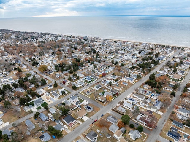 birds eye view of property featuring a water view and a view of the beach