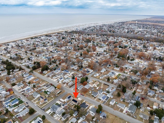 aerial view featuring a water view and a view of the beach