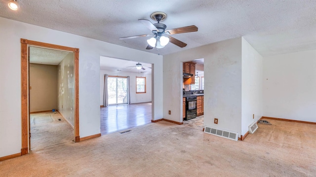 8 Sheila Ave, Seaville, NJ 08230 - empty room with light carpet, ceiling fan, a textured ceiling, and baseboards