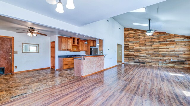8 Sheila Ave, Seaville, NJ 08230 - kitchen with a ceiling fan, dark countertops, brown cabinetry, freestanding refrigerator, and wood finished floors