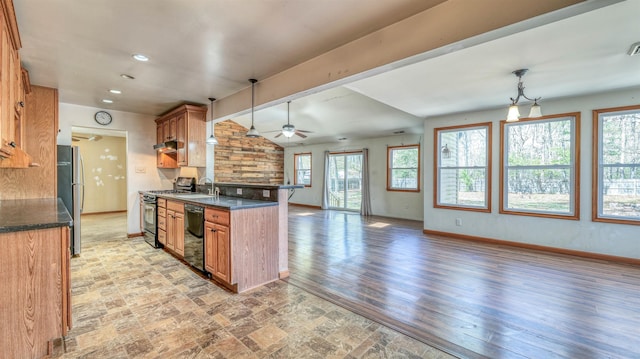 8 Sheila Ave, Seaville, NJ 08230 - kitchen with gas range oven, brown cabinets, dishwasher, baseboards, and vaulted ceiling