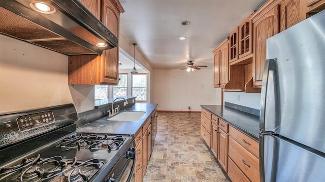 8 Sheila Ave, Seaville, NJ 08230 - kitchen with freestanding refrigerator, gas range oven, a sink, under cabinet range hood, and dark countertops