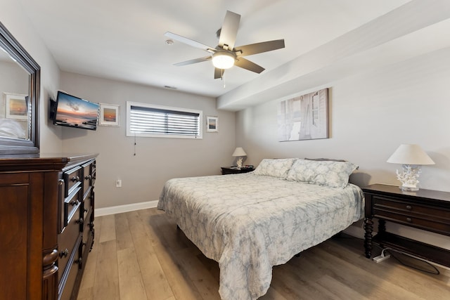 bedroom with ceiling fan and light hardwood / wood-style flooring