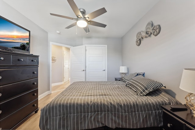 bedroom featuring ceiling fan and light wood-type flooring