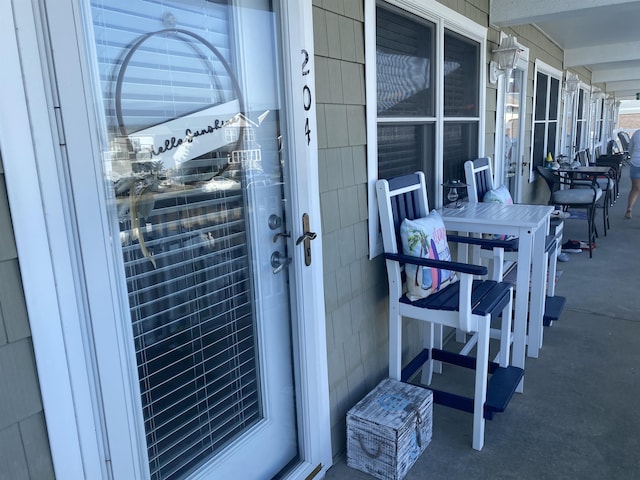 view of exterior entry with a porch