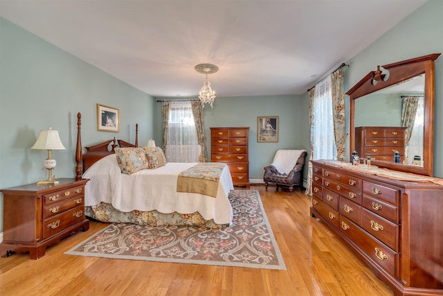645 Hughes St, Cape May, NJ 08204 - bedroom featuring light wood-type flooring and a chandelier
