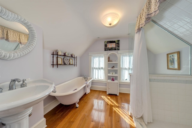 645 Hughes St, Cape May, NJ 08204 - full bath featuring a freestanding bath, lofted ceiling, and hardwood / wood-style flooring