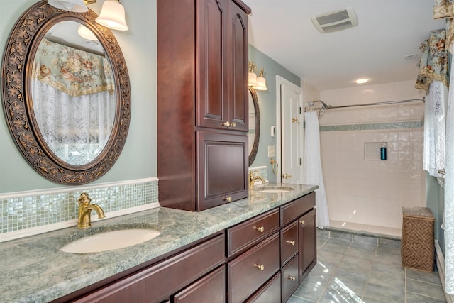645 Hughes St, Cape May, NJ 08204 - full bath featuring a tile shower, double vanity, and tile patterned floors