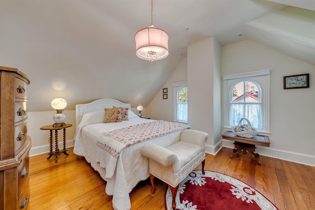 645 Hughes St, Cape May, NJ 08204 - bedroom with vaulted ceiling and light wood-style floors