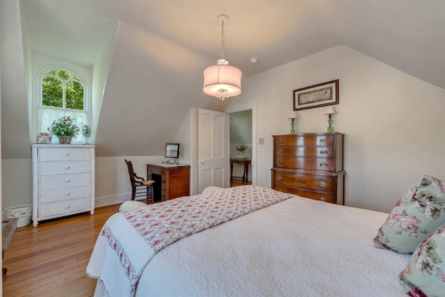 645 Hughes St, Cape May, NJ 08204 - bedroom with vaulted ceiling and wood finished floors