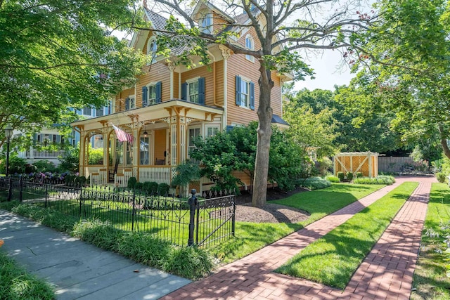 645 Hughes St, Cape May, NJ 08204 - view of front of house featuring a porch and a fenced front yard