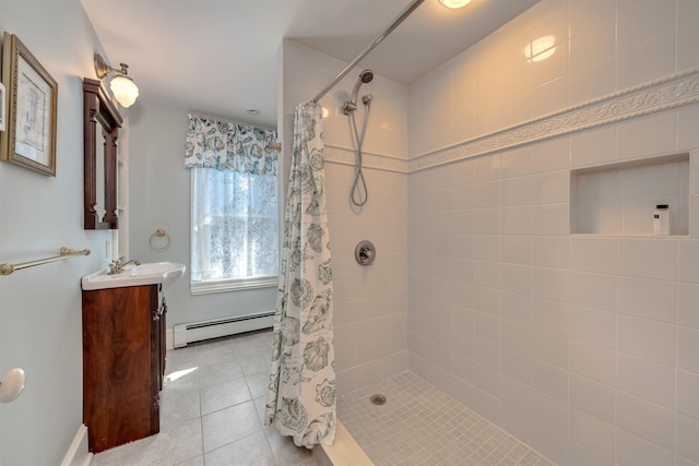 645 Hughes St, Cape May, NJ 08204 - bathroom with a baseboard radiator, a tile shower, vanity, and tile patterned floors