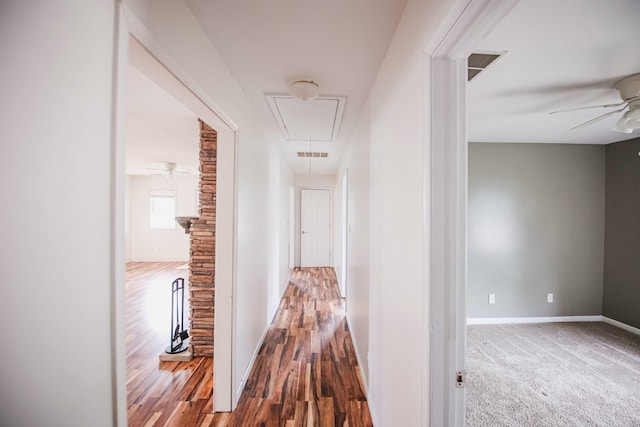 hallway featuring wood-type flooring