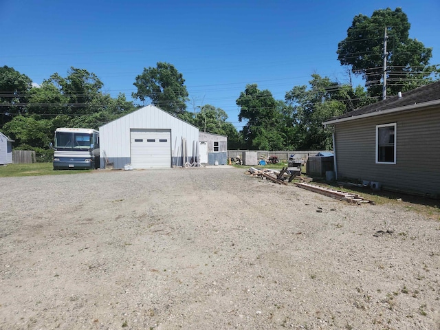 exterior space with an outbuilding and a garage