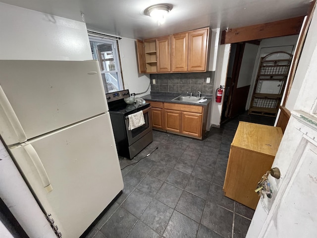 kitchen with tasteful backsplash, white fridge, stainless steel electric stove, and sink