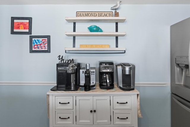 bar with stainless steel fridge with ice dispenser