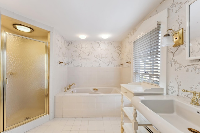 full bath featuring a garden tub, wallpapered walls, tile patterned floors, a sink, and a stall shower