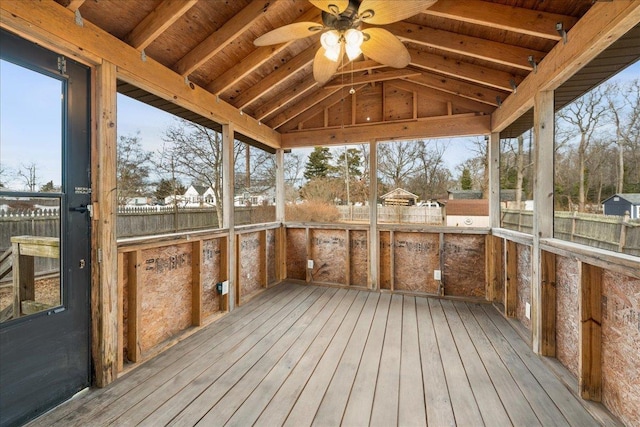 unfurnished sunroom featuring lofted ceiling, wooden ceiling, and ceiling fan