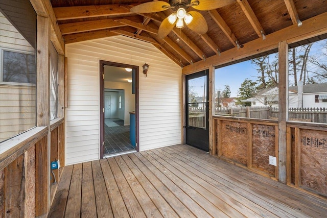 unfurnished sunroom featuring wood ceiling, lofted ceiling with beams, and ceiling fan