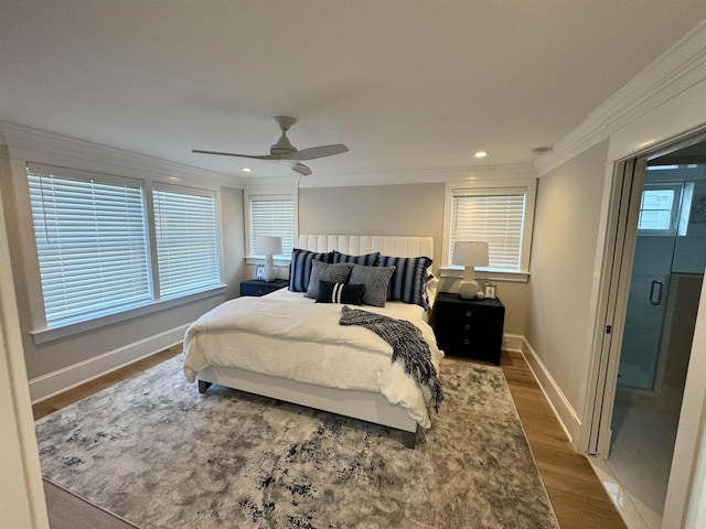 bedroom with ceiling fan, crown molding, and wood-type flooring