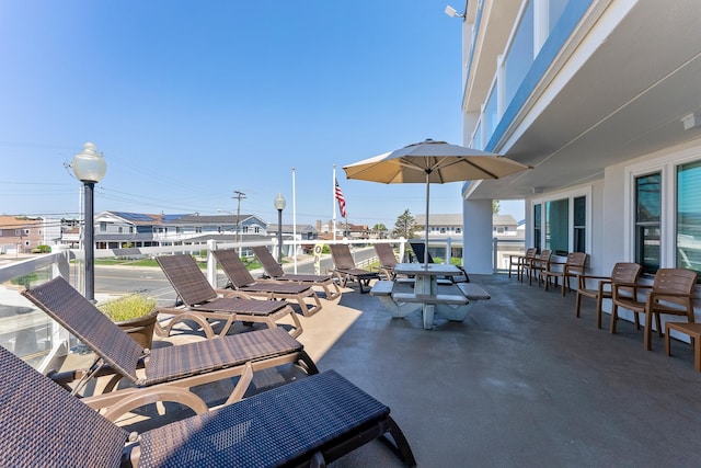 view of patio featuring a balcony