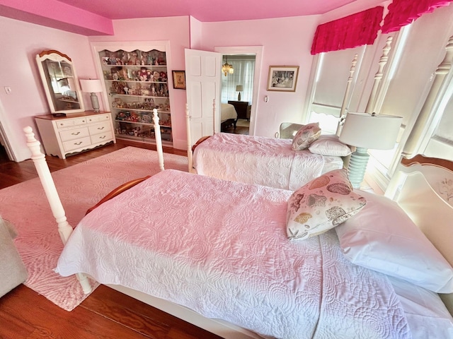 bedroom with hardwood / wood-style flooring