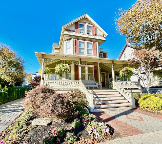 victorian house featuring covered porch