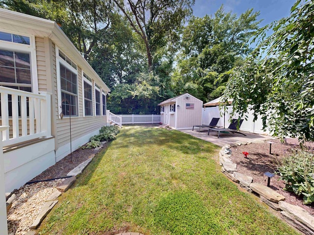 63 Cape Woods Rd, North Cape May, NJ 08204 - fenced backyard with a storage unit and a patio area