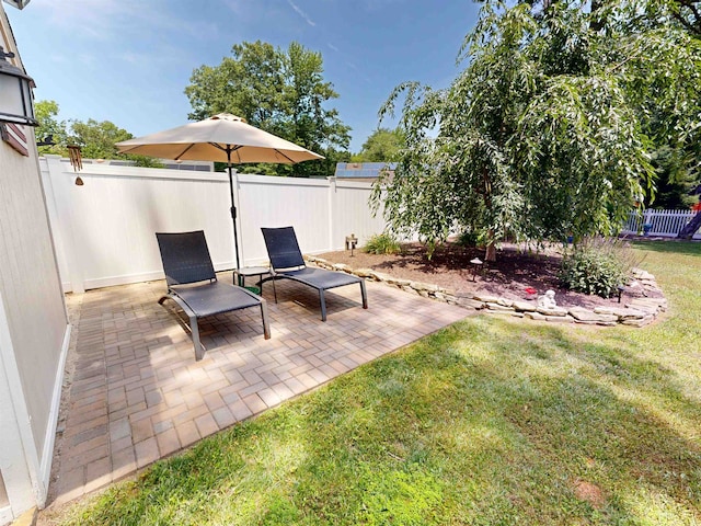 63 Cape Woods Rd, North Cape May, NJ 08204 - fenced backyard with a patio area